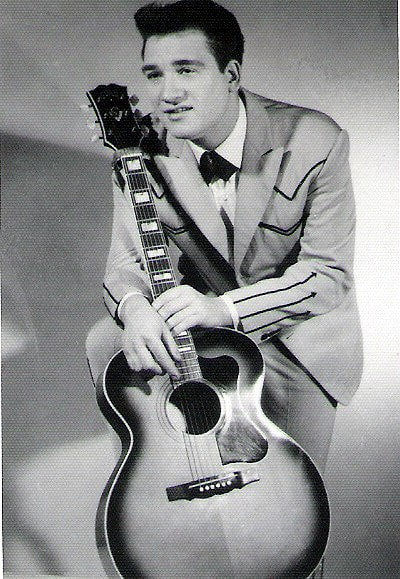 Country music star Mickey Barnett with his guitar.